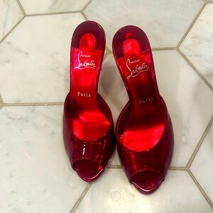 Christian Louboutin patent red peep toes worn twice.